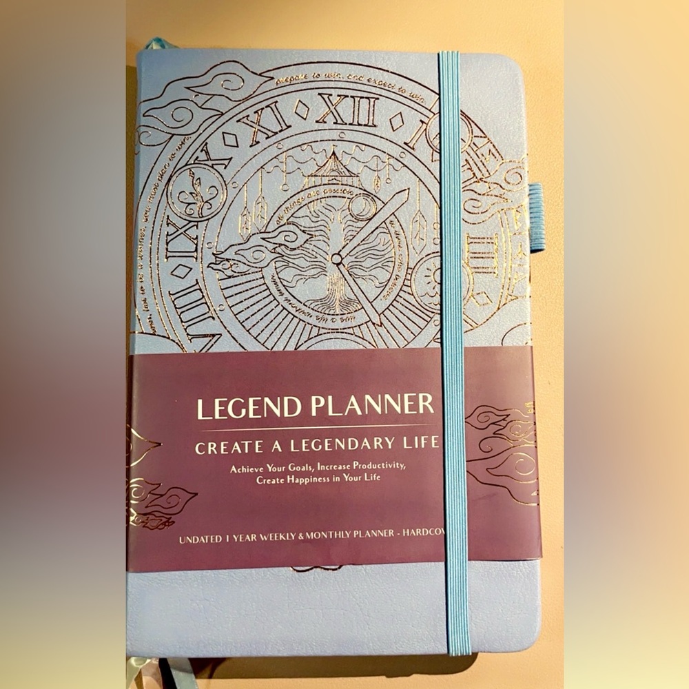Blue and Gold Legend Planner with Intricate Emblem